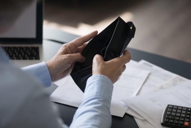 Woman with empty wallet